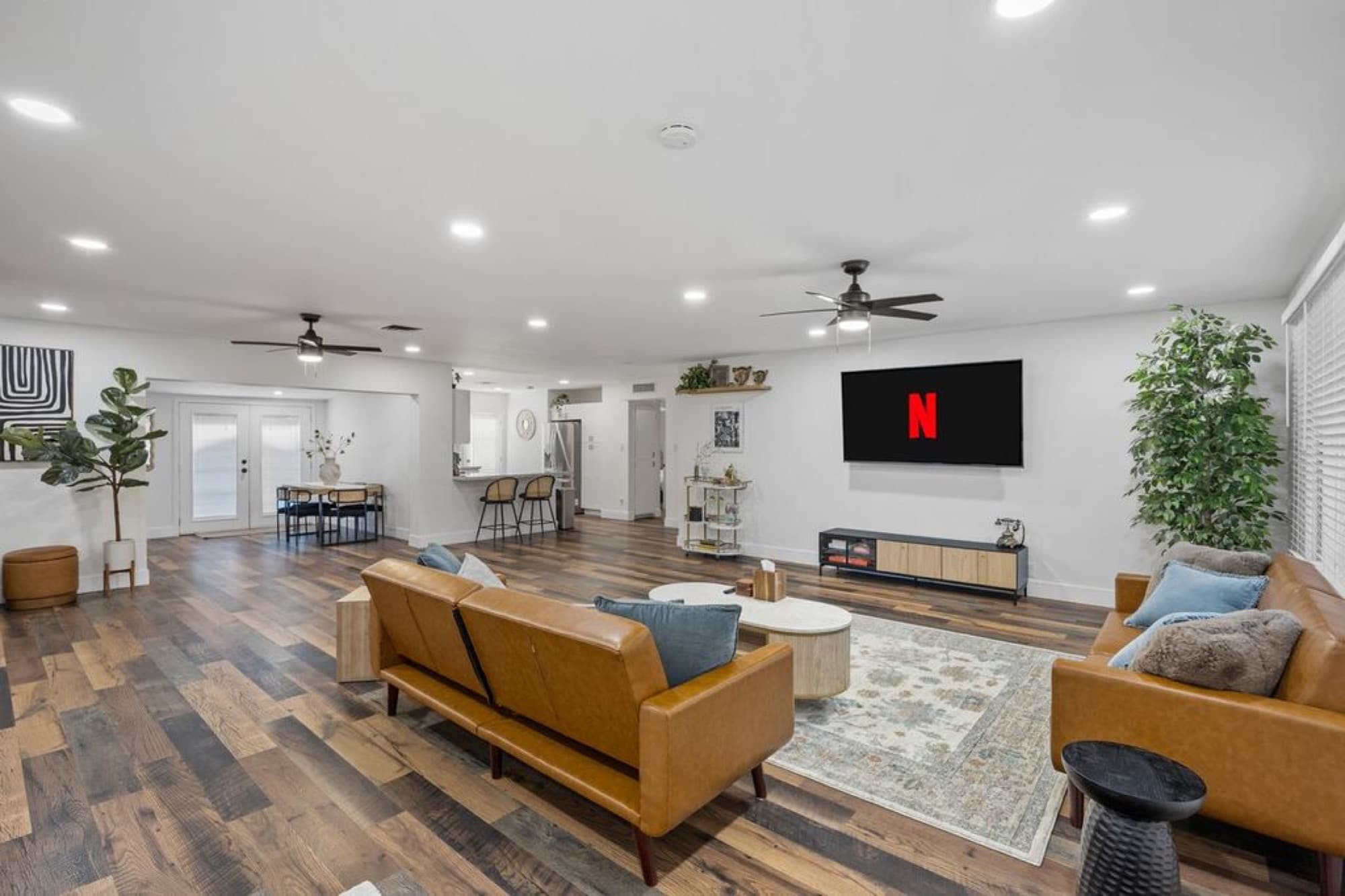 The great room: leather sofas, media lounge, and gathering space